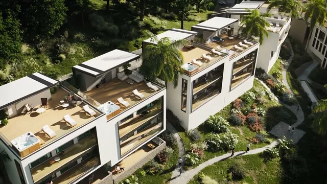 Luftaufnahme der Anlage Guru Subtropical mit Dachterrassen und Pools